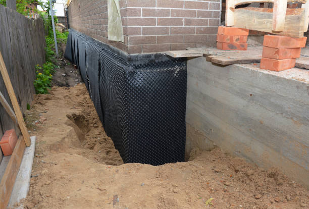 Happy homeowners after waterproofing job in Mont Clare